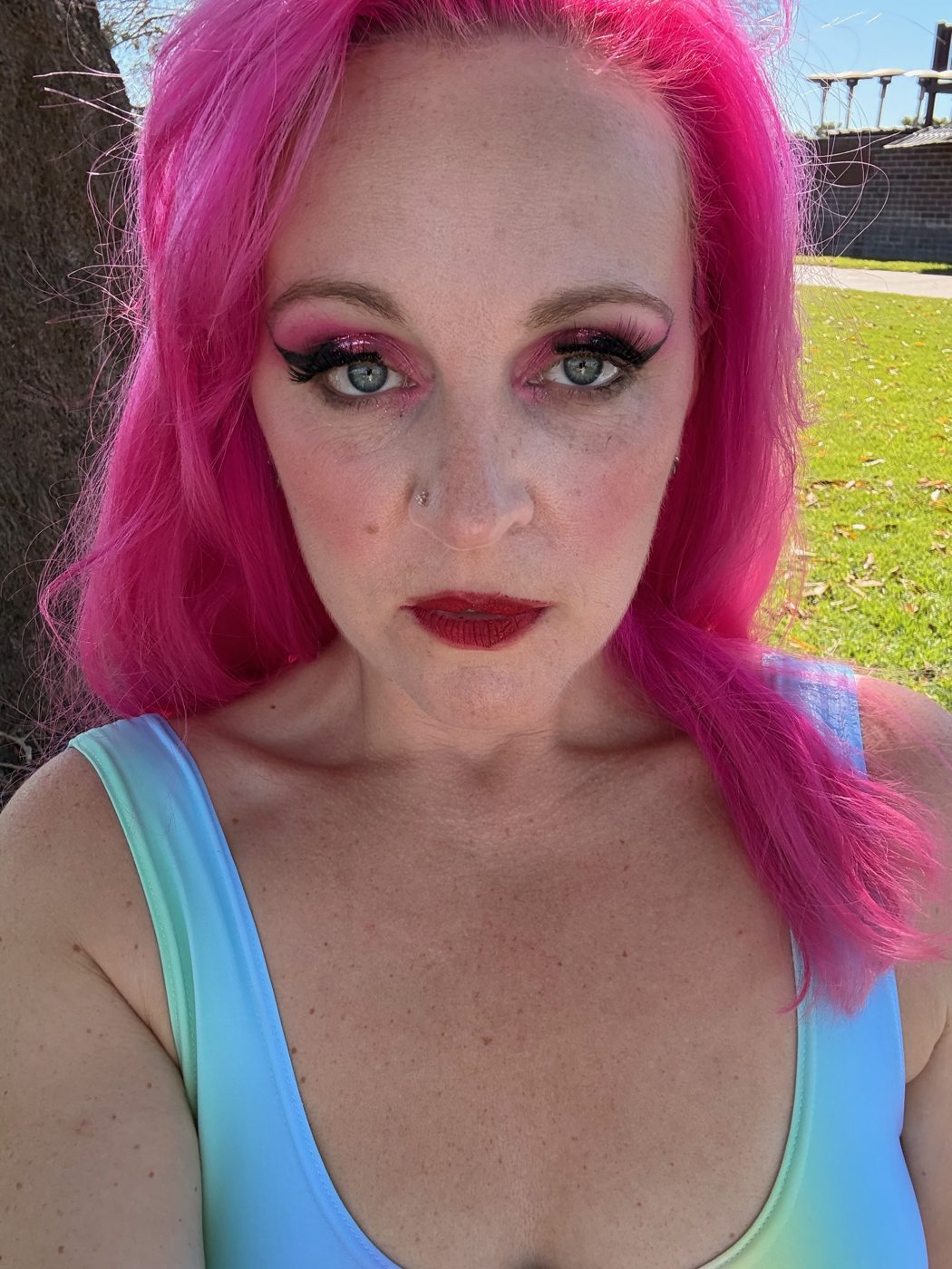 Jessica close up, pink hair and bold makeup